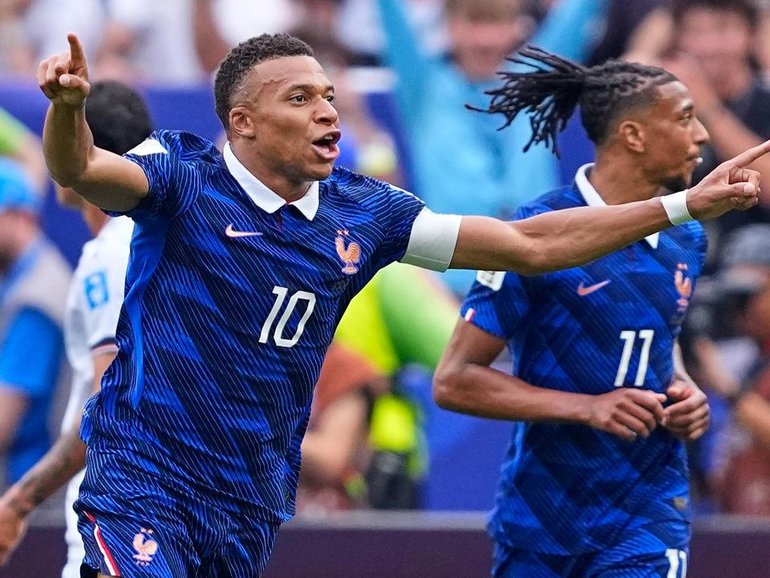 Kylian Mbappe has blasted home a brace in his milestone match for France against Iraq. (AP PHOTO)