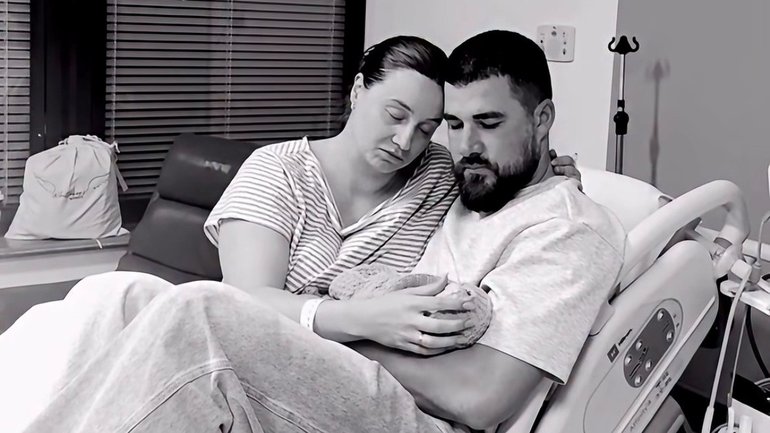 The influencer shared a post of her holding daughter Maggie Jean while sitting on a hospital bed with husband Nathan.
