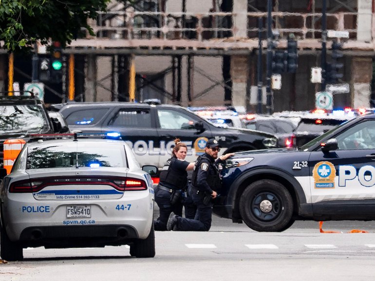 Montreal police work the scene of a shooting in the Jewish neighbourhood of Cote-des-Neiges.