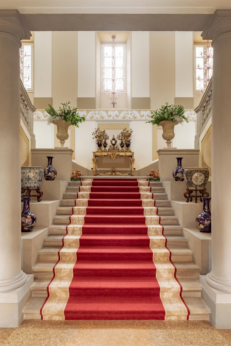 Grand staircases and fountains hint at the scale of the original vision.