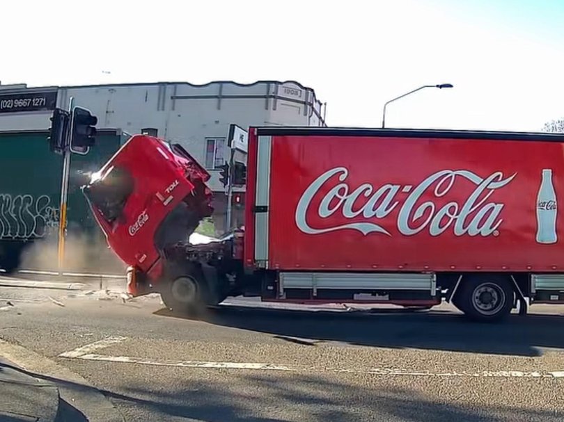 The truck driver was caught in the cab as it fell off the front of the truck.