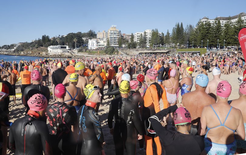 The community swim attracted thousands of people.