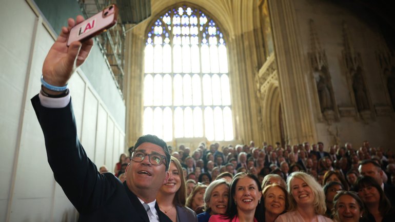The favourite to replace Keir Starmer, Labour MP Andy Burnham, takes a selfie with the Parliamentary Labour Party after his swearing-in on June 22.