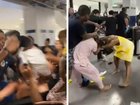 More than a dozen passengers have been banned from a cruise liner after an unruly brawl erupted at a ship port in Florida.
