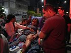 A woman is carried on a stretcher following an earthquake in Caracas on June 24, 2026. A magnitude 7.1 earthquake struck Venezuela on Wednesday, the United States Geological Survey (USGS) reported, triggering panic in Caracas, according to AFP journalists. The tremor, which was followed by several aftershocks, was also felt in Colombia. (Photo by Manaure QUINTERO / AFP) MANAURE QUINTERO