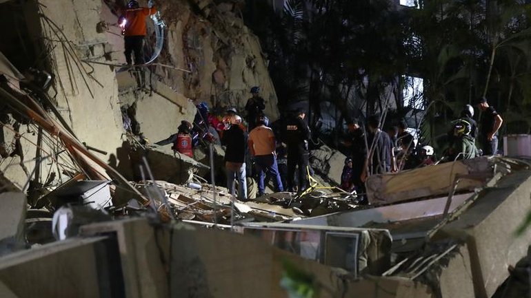 Emergency responders are searching the rubble in Caracas as the quake death toll climbs.