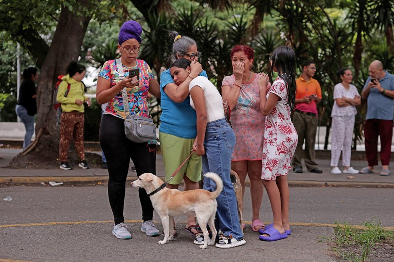People react as they gather after an earthquake, in Caracas, Venezuela, June 24, 2026.