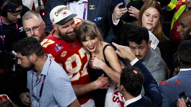 Taylor Swift hugs Travis Kelce after the Chiefs won Super Bowl LVIII in 2024. 