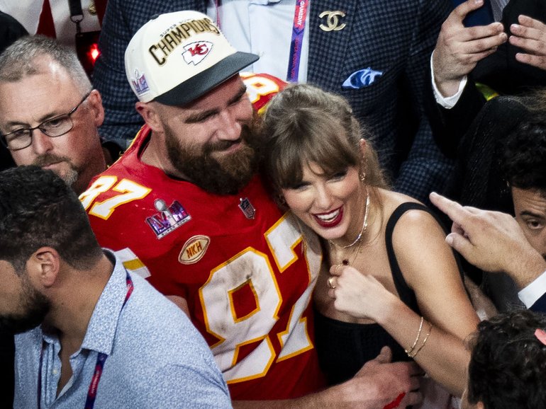 Taylor Swift hugs Travis Kelce after the Chiefs won Super Bowl LVIII in 2024. 