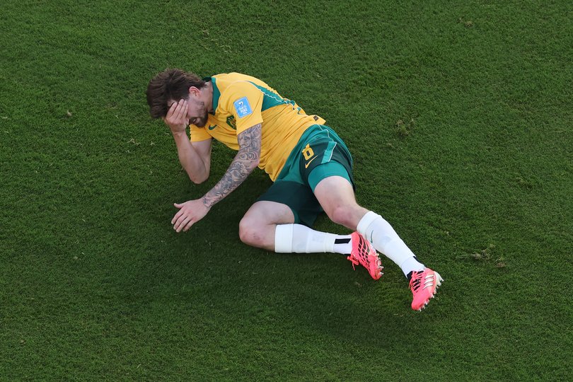 Connor Metcalfe #8 of Australia reacts after sustaining an injury.