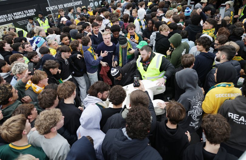 MELBOURNE, AUSTRALIA- NewsWire Photos JUNE 26, 2026: Socceroo fans push their way into Federation Square in Melbourne ahead of the world cup game against Paraguay. NewsWire/ David Crosling