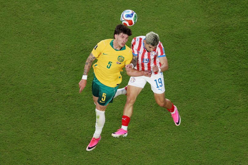 SANTA CLARA, CALIFORNIA - JUNE 25: Jordan Bos #5 of Australia competes for the ball against Julio Enciso #19 of Paraguay during the FIFA World Cup 2026 Group D match between Paraguay and Australia at San Francisco Bay Area Stadium on June 25, 2026 in Santa Clara, California. (Photo by Richard Heathcote/Getty Images)
