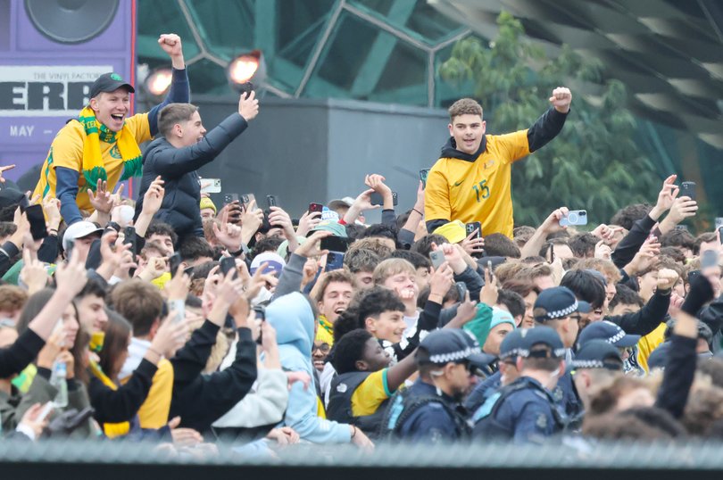 Socceroo fans inside Federation Square in Melbourne ahead of the World Cup game against Paraguay. 