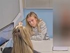 Footage shows a calm, unbothered nursery worker.