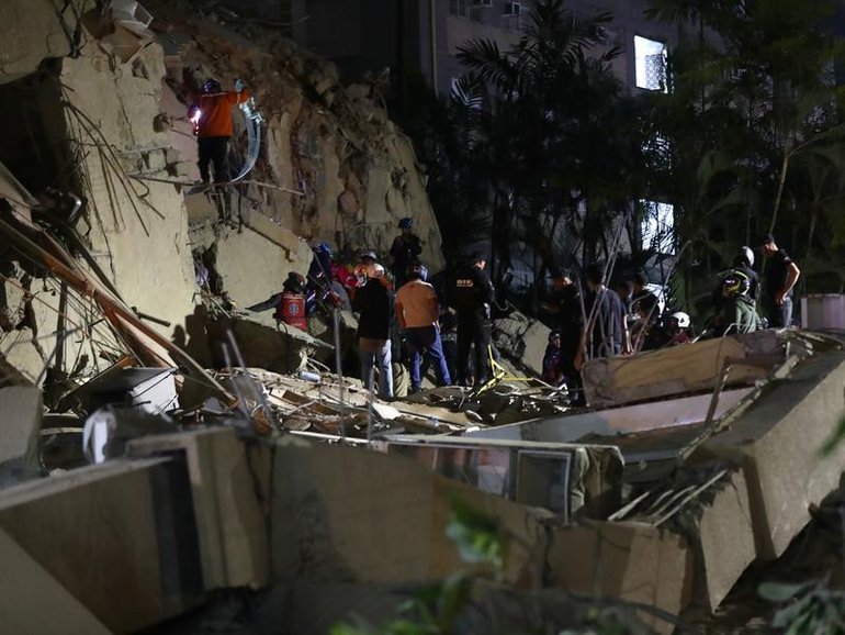 Emergency responders searching the rubble in Caracas.