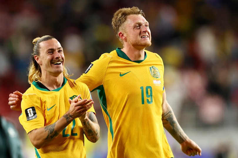 Jackson Irvine and Harry Souttar of Australia celebrate.