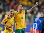 Australia's Harry Souttar (19) and Jackson Irvine (22) celebrate reaching the World Cup's last 32. (AP PHOTO)
