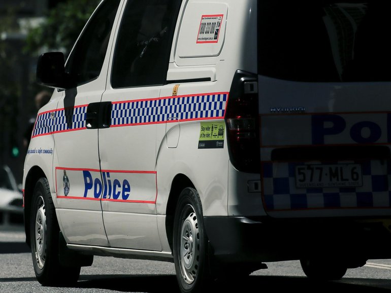 A man armed with a rifle has been shot by Queensland Police after a confrontation with officers on Friday night. 