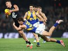Patrick Cripps of the Blues is tackled by Jobe Shanahan.