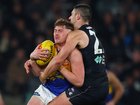 Marc Pittonet of the Blues tackles Harley Reid.
