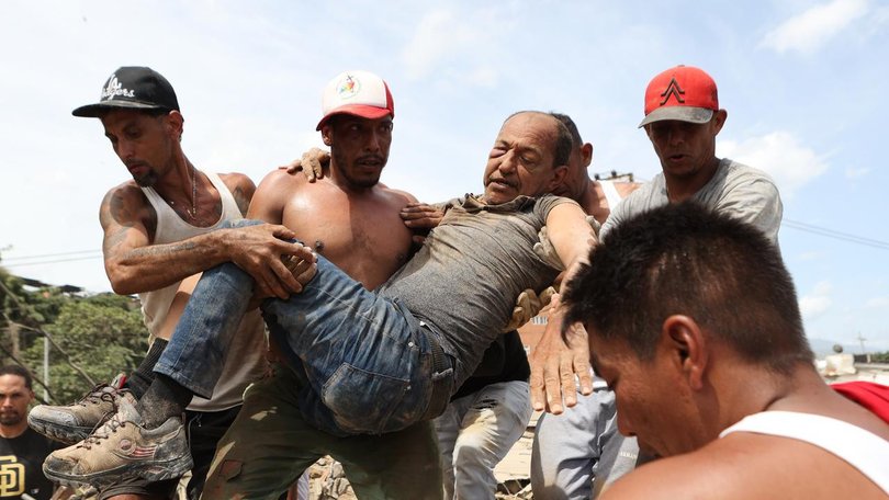 International rescue crews have arrived to help find survivors after Venezuela's earthquakes. (AP PHOTO)