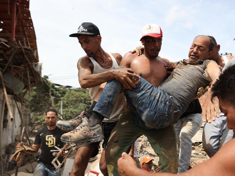 Venezuelans are making frantic efforts to find survivors amid the rubble of destroyed buildings. 