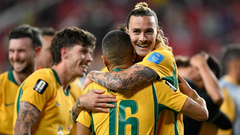 Jackson Irvine and the Socceroos celebrate the crucial draw with Paraguay. (AP PHOTO)