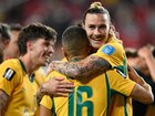 Jackson Irvine and the Socceroos celebrate the crucial draw with Paraguay. (AP PHOTO)