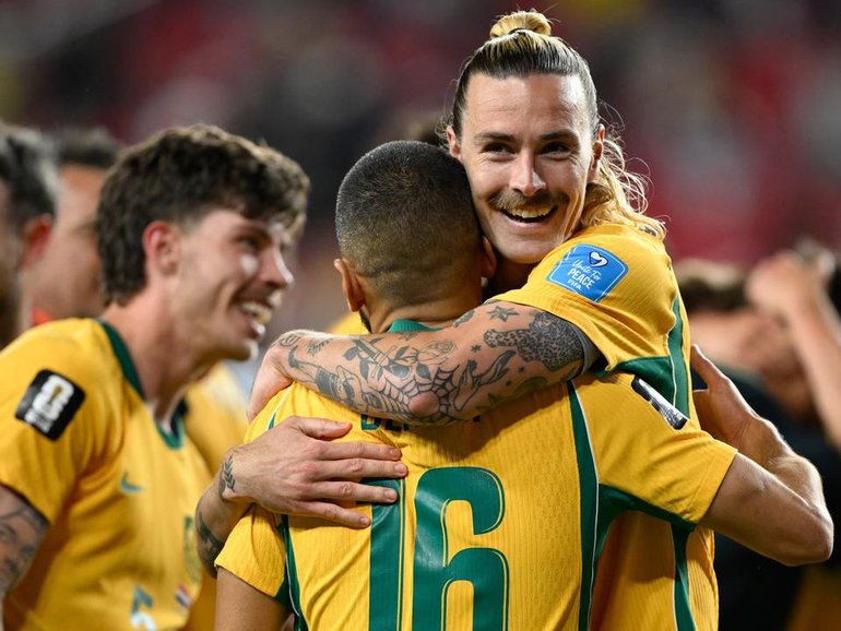 Jackson Irvine and the Socceroos celebrate the crucial draw with Paraguay. (AP PHOTO)