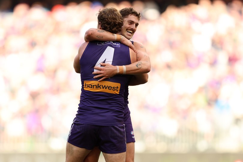 Luke Jackson of the Dockers celebrates a goal with Sean Darcy.