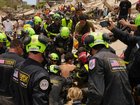 Several children have been rescued as foreign volunteers arrive to help recovery efforts.