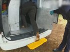 A man steps into a police van after being charged with the murder and torture of a baby boy. (HANDOUT/QUEENSLAND POLICE)