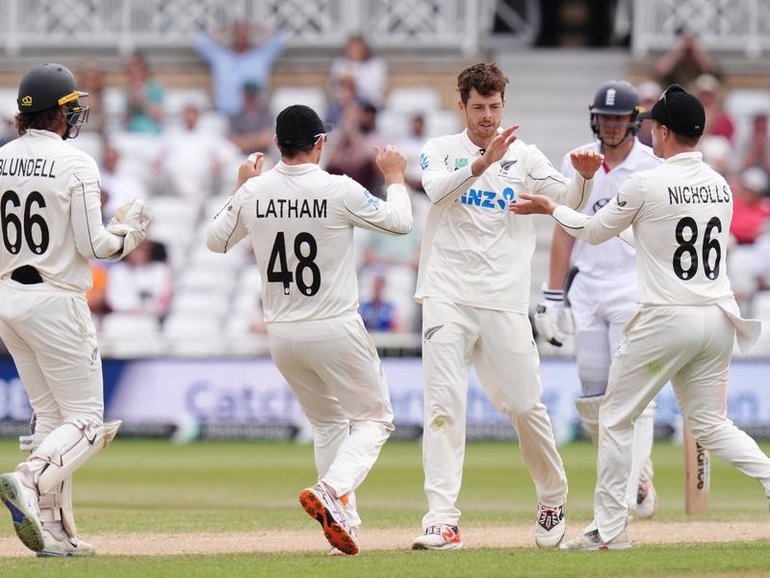 New Zealand's Mitch Santner celebrates with teammates as they close in on Test victory over England. 