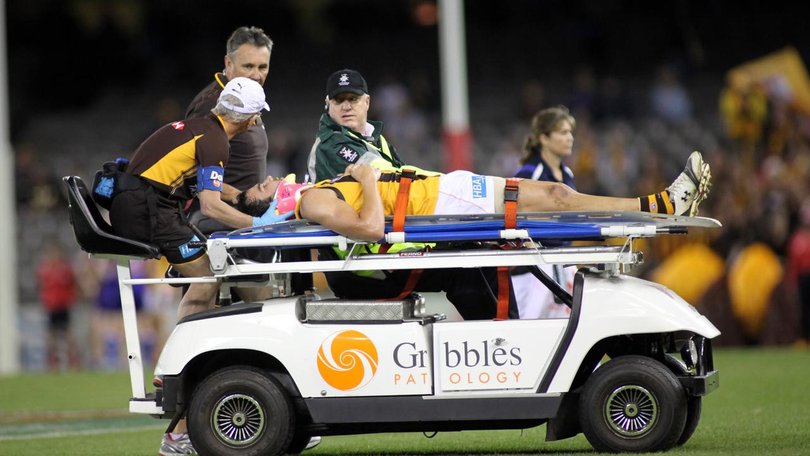 Jordan Lewis is stretchered off the ground after he was knocked out in a 2010 match.  (David Crosling/AAP PHOTOS)