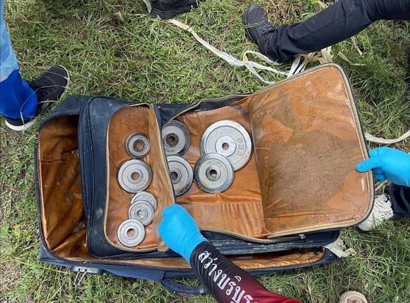 Weights seen in the suitcase.