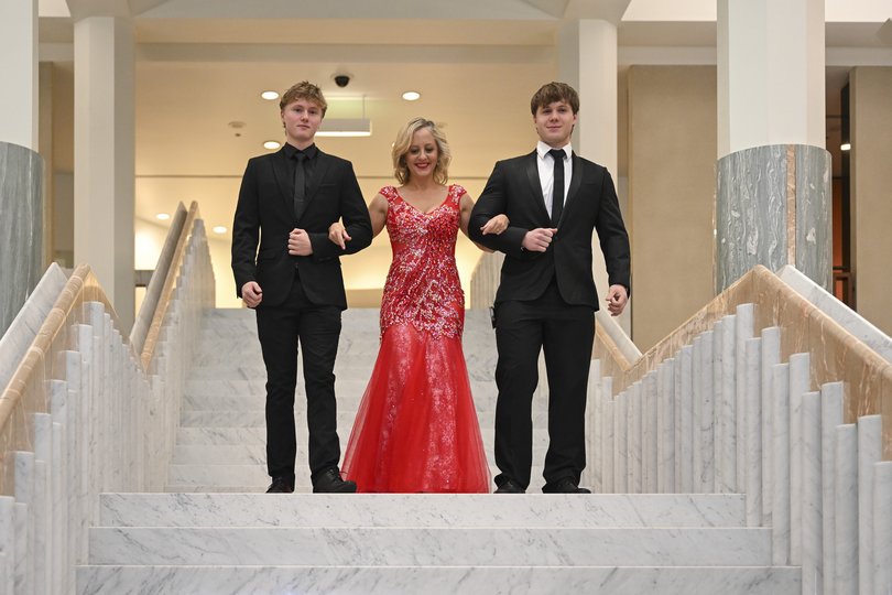 Melissa McIntosh MP and sons Coby and Byron arrive at the Federal Parliamentary Press Gallery Mid-Winter Ball at Parliament House.