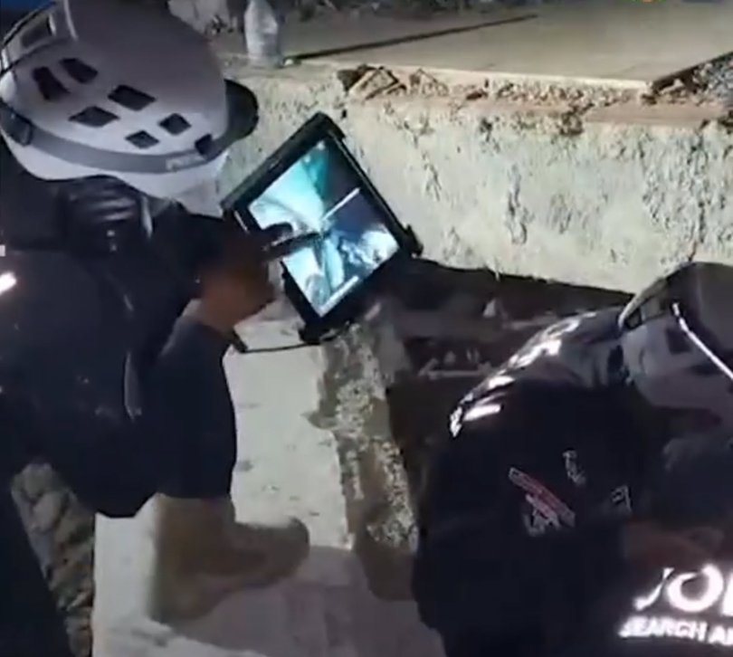 Jordan Public Security post to Facebook shows the rescue of a three-year-old boy from Venezuela quake Picture: Unknown