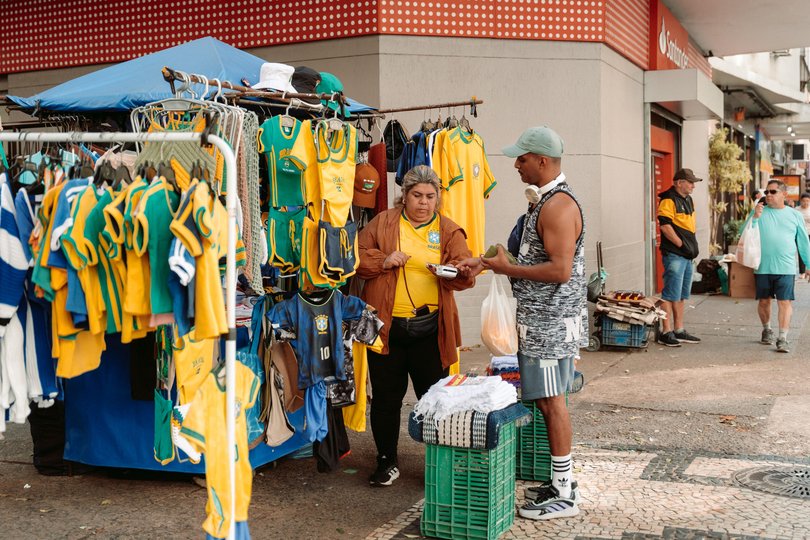 Markets line the streets in Copacabana, selling Brazilian shirts. 