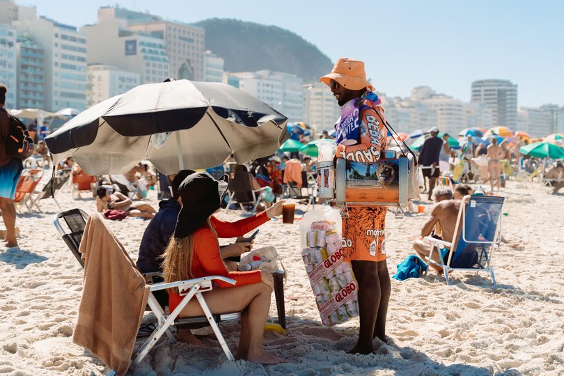 A vendor sells drinks on the world famous Copacabana Beach. 
