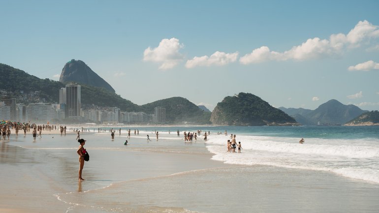 People enjoy the magnificent view from Copacabana Beach. 