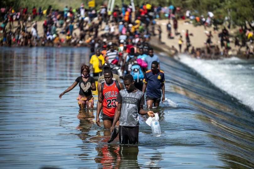 Migrants are shown crossing the US-Mexico border in 2021. The court and Trump were arguably even more aligned on restricting immigration.