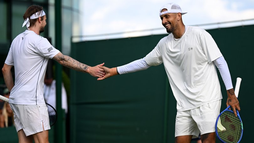 Nick Kyrgios of Australia and Alexander Bublik exchange a high-five.