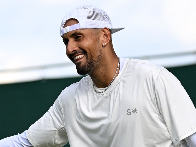 Nick Kyrgios of Australia and Alexander Bublik exchange a high-five.