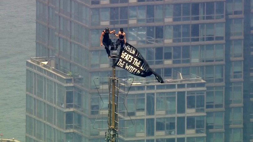 Russian daredevils unfurled a massive banner on top of the Empire State Building. (AP PHOTO)