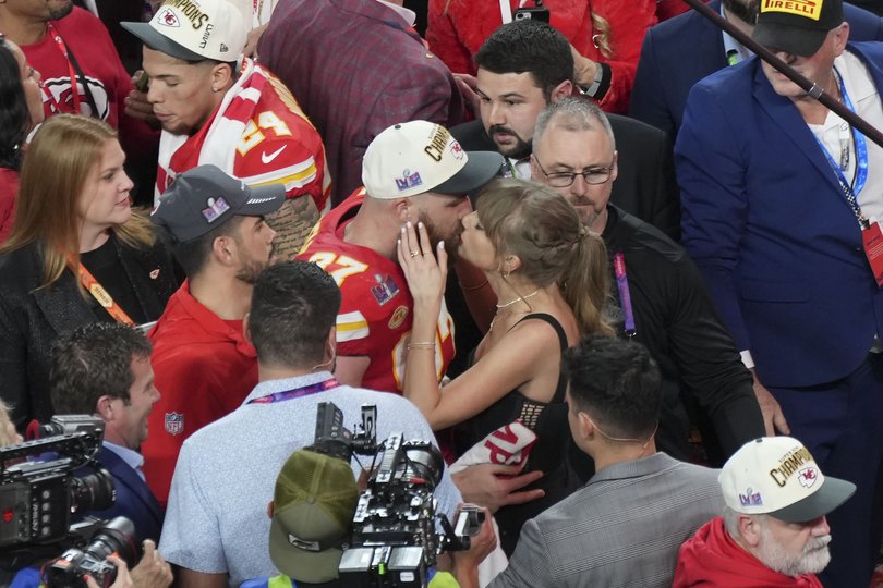 Taylor Swift kisses Kansas City Chiefs tight end Travis Kelce after the Chiefs won Super Bowl LVIII against the San Francisco 49ers at Allegiant Stadium in Las Vegas, Feb. 11, 2024.
