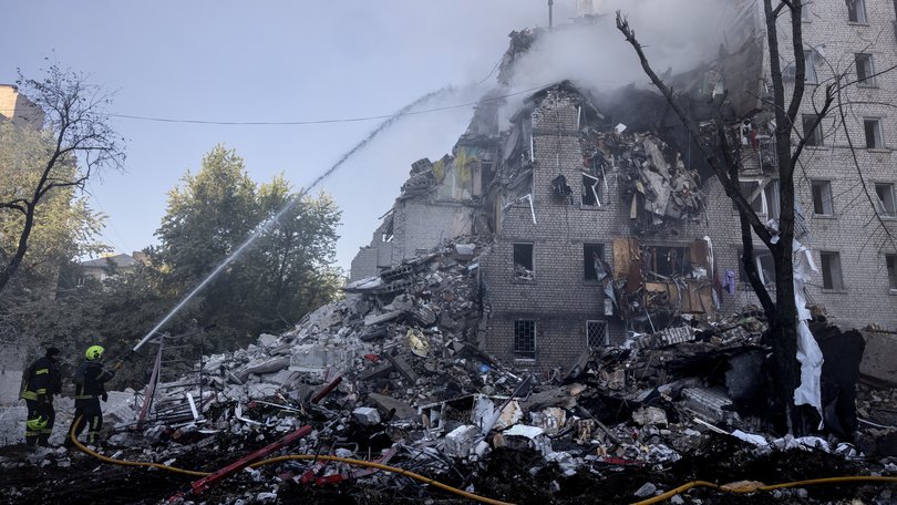 Firefighters battle major fires after a drone and missile attack by Russian forces on July 2, 2026 in Kyiv.