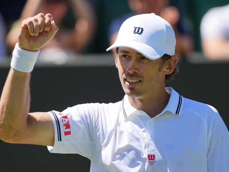 Alex de Minaur savours his second-round success in the southwest London sunshine. 