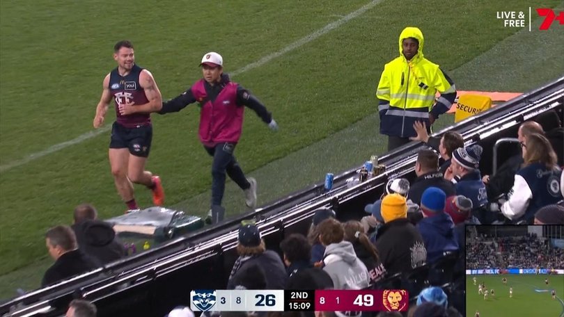 Brisbane star Lachie Neale watches on as Cats fans have their say.