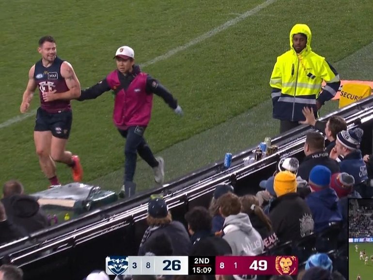 Brisbane star Lachie Neale watches on as Cats fans have their say.