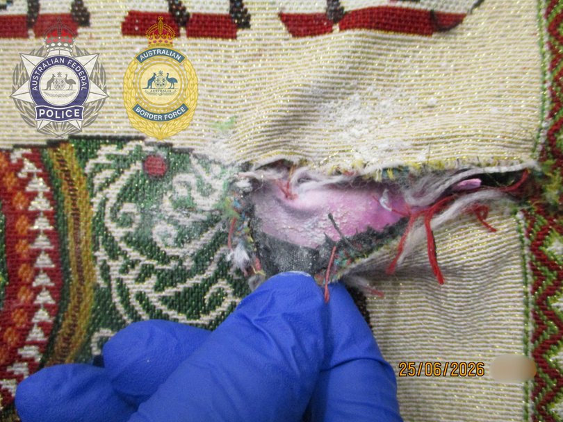 Further searches allegedly uncovered a white powered hidden within the lining of the bags that later tested positive as heroin.